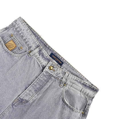 Louis Vuitton leather label pocket faded denim jeans
