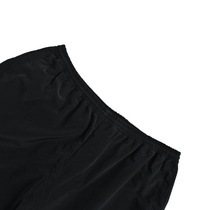 Acne Studios black and white patchwork embroidered logo trousers