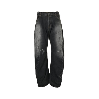 Acne Studios distressed scimitar jeans with splashes of ink