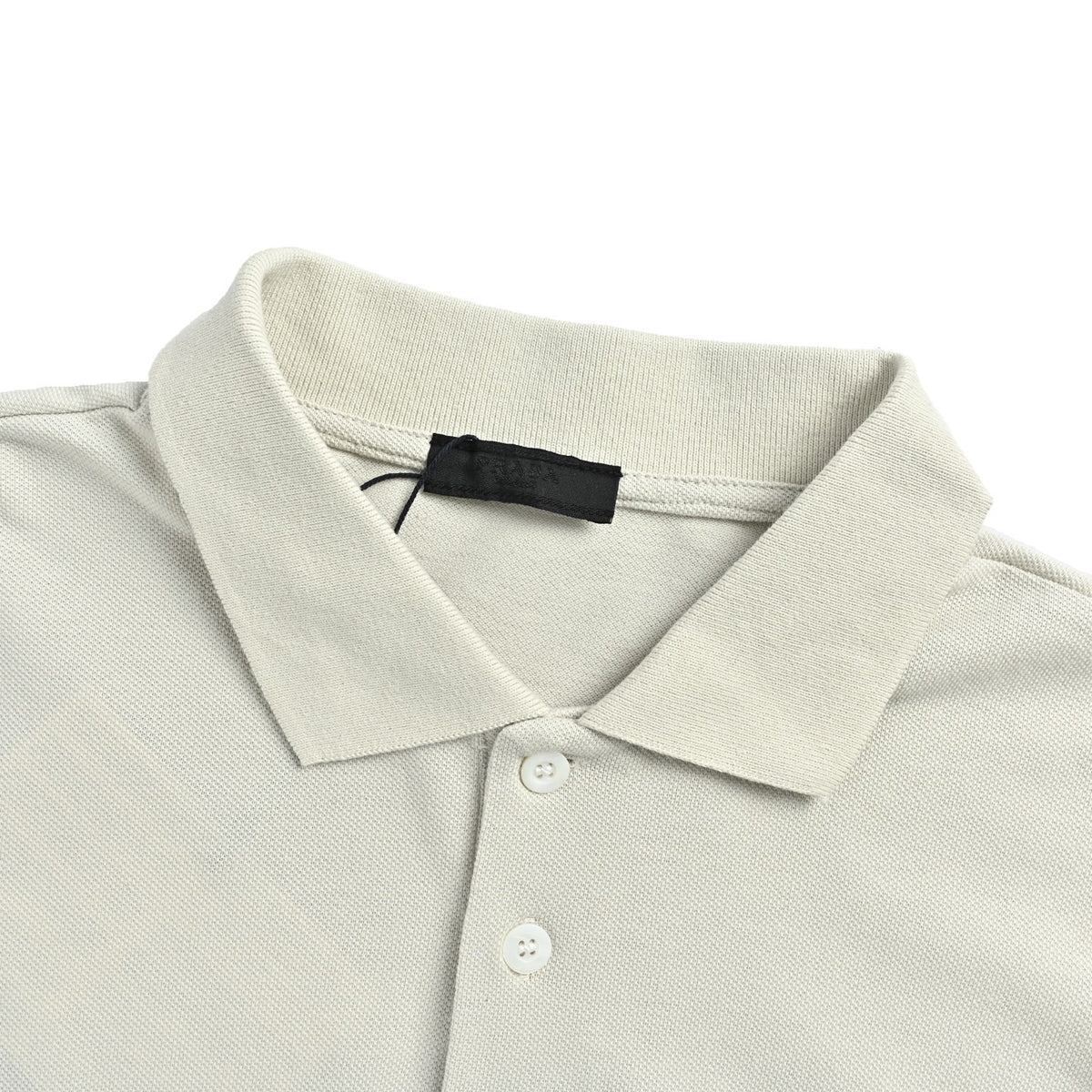 Prada 26ss Polo short sleeves with embroidered chest badge and small label
