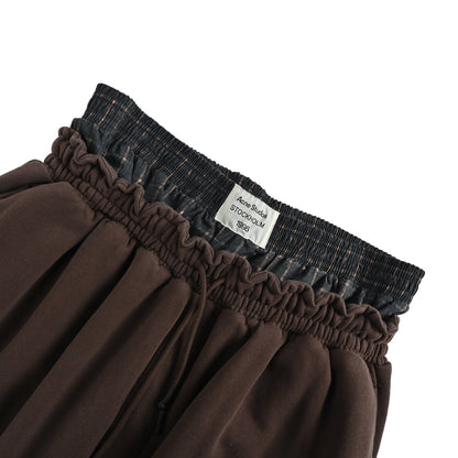 Acne Studios GYM distressed fake two piece logo trousers