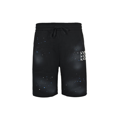 DG/Dolce & Gabbana laminated logo distressed shorts