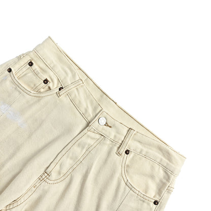 Acne Studios white mud dyed and splashed ink distressed scimitar jeans
