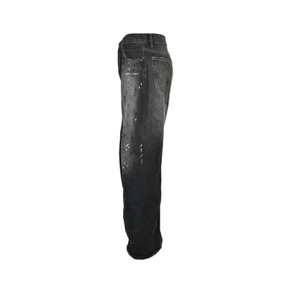 Acne Studios distressed scimitar jeans with splashes of ink