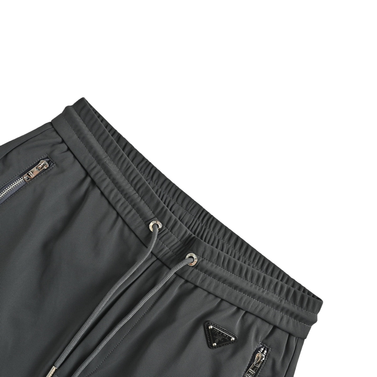Prada triangle logo red tape trousers